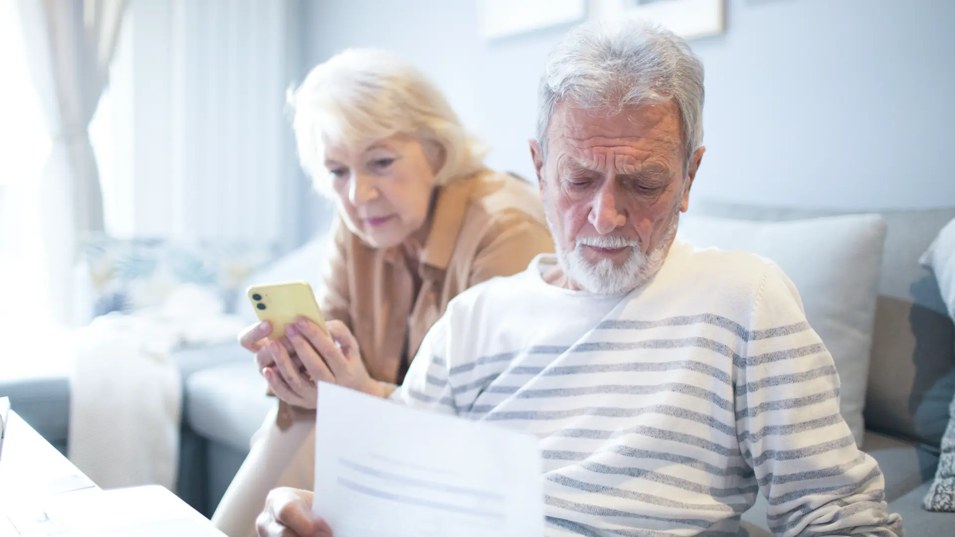 old men women reading paper